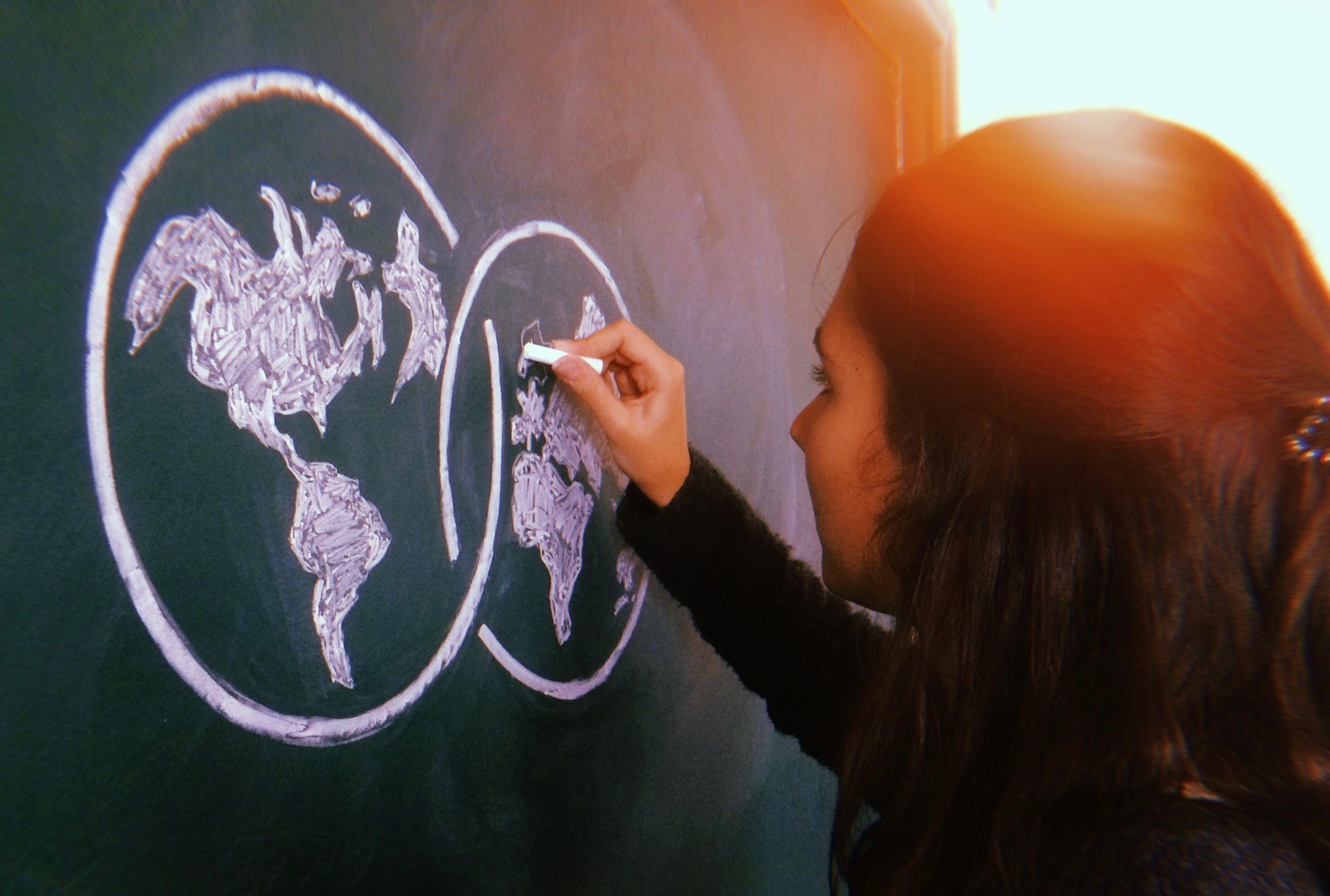 student drawing UWC logo